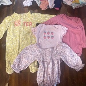Bundle of 4 pieces. Carter's Yellow, Pink, and White Kids One Pieces